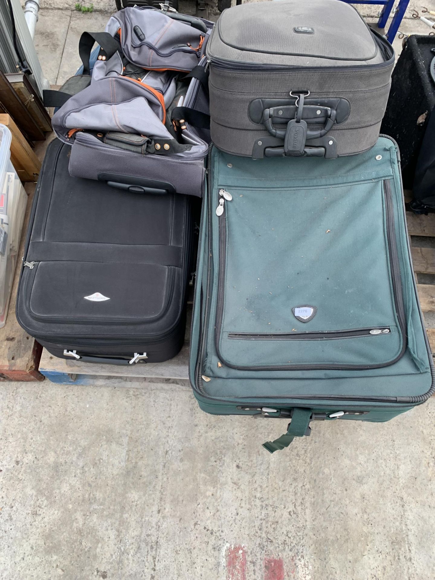 AN ASSORTMENT OF SUITCASES