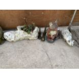 THREE RECONSTITTUED STONE GARDEN ITEMS TO INCLUDE A FOX AND A CAT AND A PAIR OF CAST IRON COBBLERS