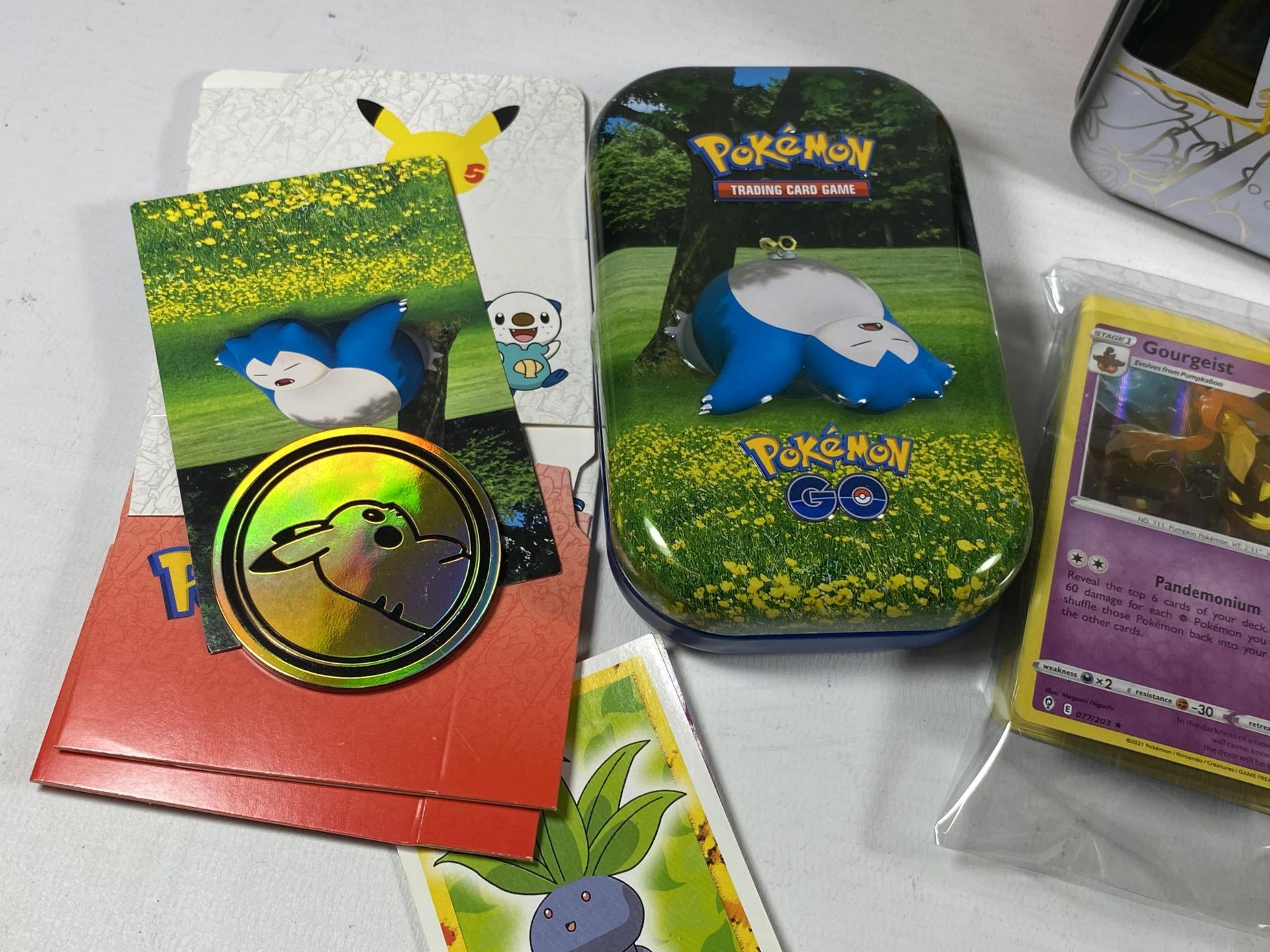 A POKEMON 25TH ANNIVERSARY TIN WITH ASSORTED CARDS, GAME TOKENS ETC - Image 3 of 3