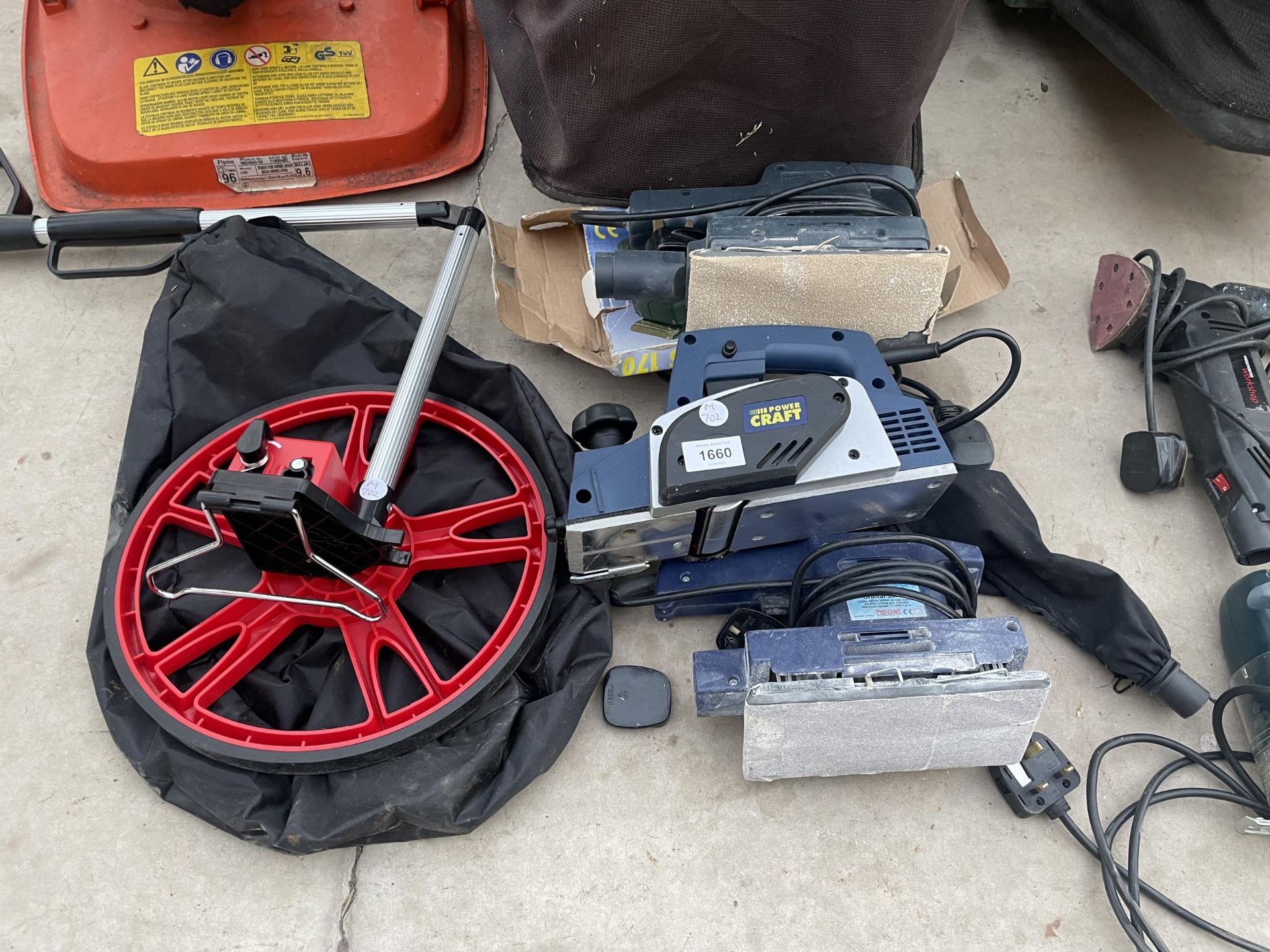 AN ASSORTMENT OF TOOLS TO INCLUDE A POWER CRAFT ELECTRIC PLANE, AN ELECTRIC SANDER AND A MEASURING