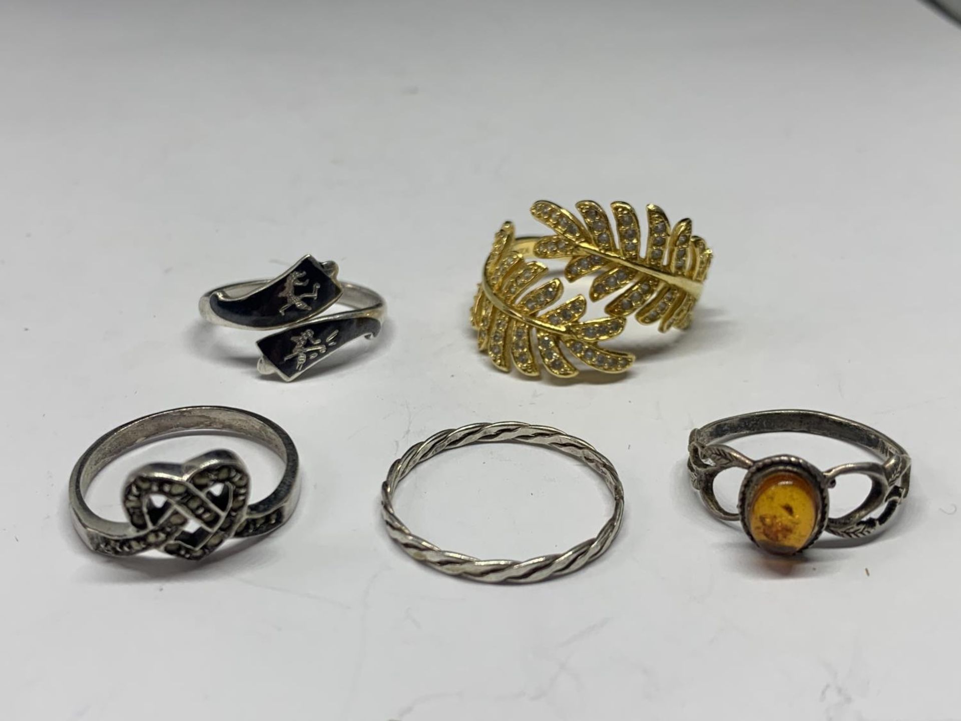 FIVE VARIOUS SILVER RINGS