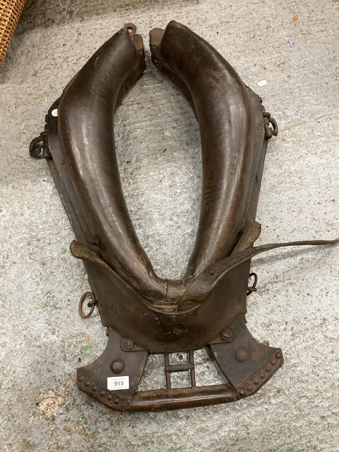 A LARGE LEATHER HORSE COLLAR