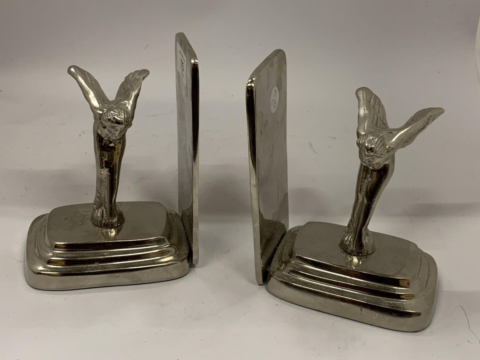 A PAIR OF CHROME STYLE SPIRIT OF ECSTASY BOOKENDS