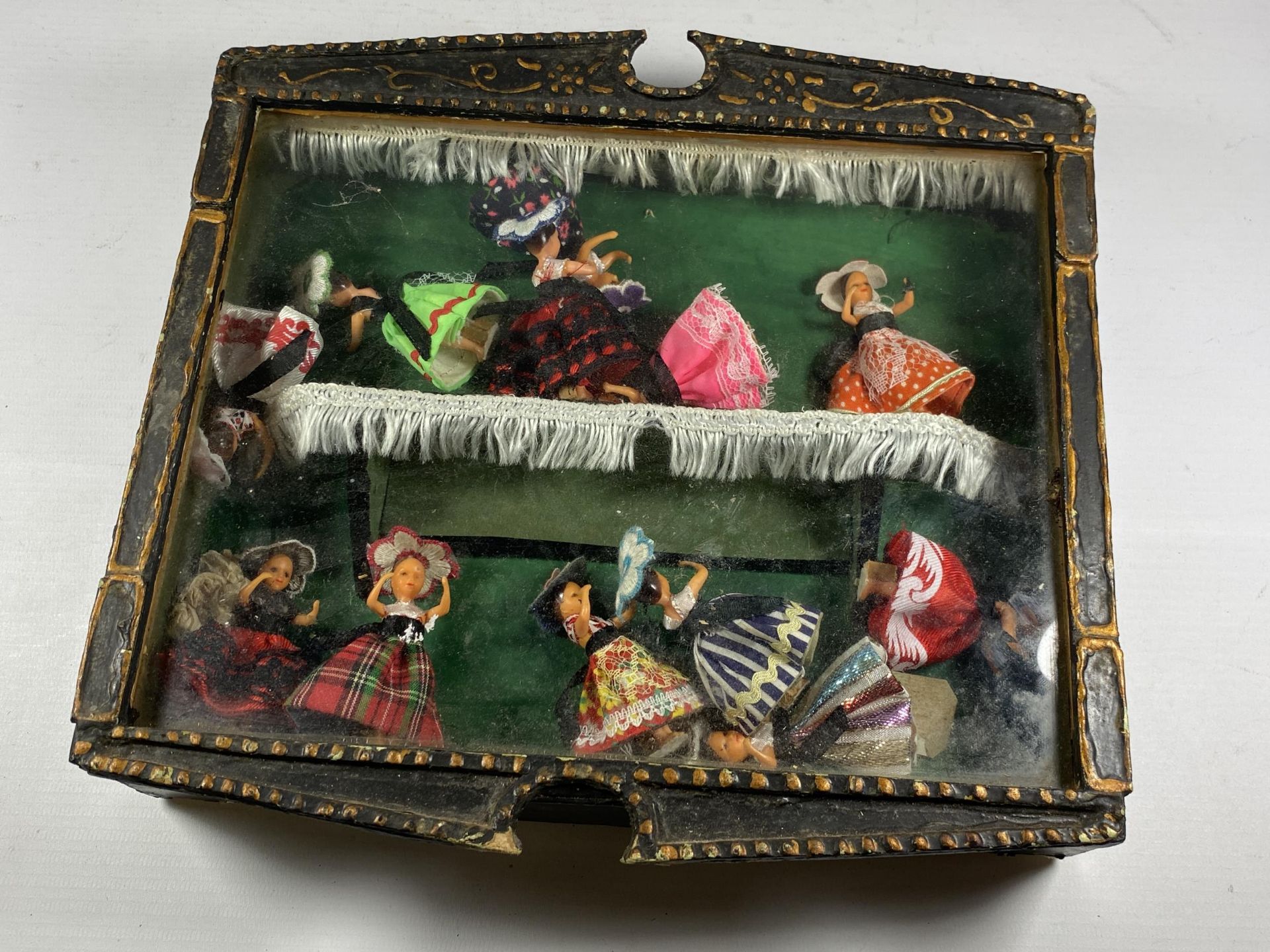 A VINTAGE WOODEN CASED SET OF DANCING LADY FIGURES