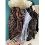 A LARGE ASSORTMENT OF LADIES CLOTHING TO INCLUDE FUR JACKETS ETC