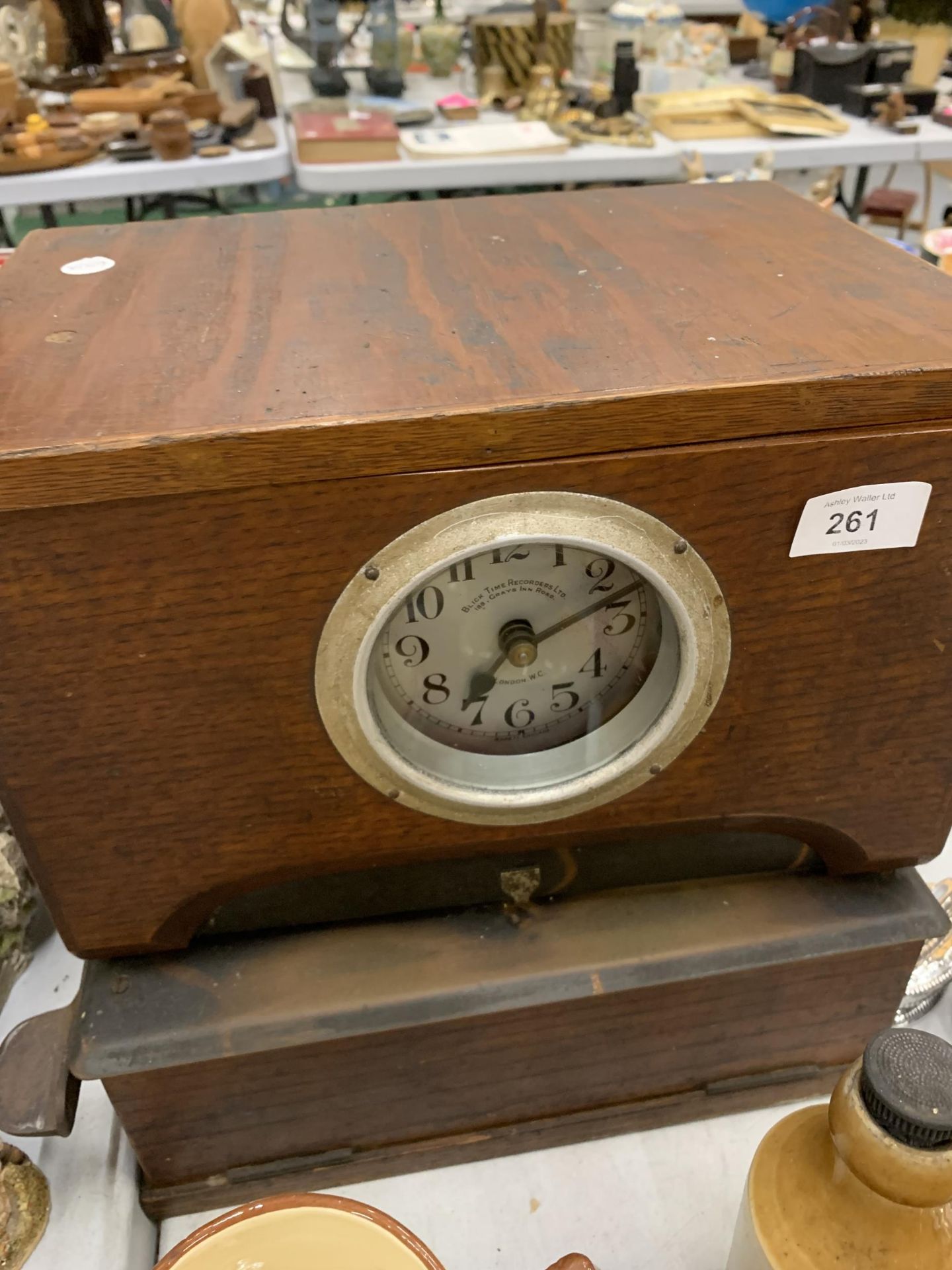 A VINTAGE 'BLICK TIME RECORDERS' CLOCKING IN CLOCK IN A MAHOGANY CASE