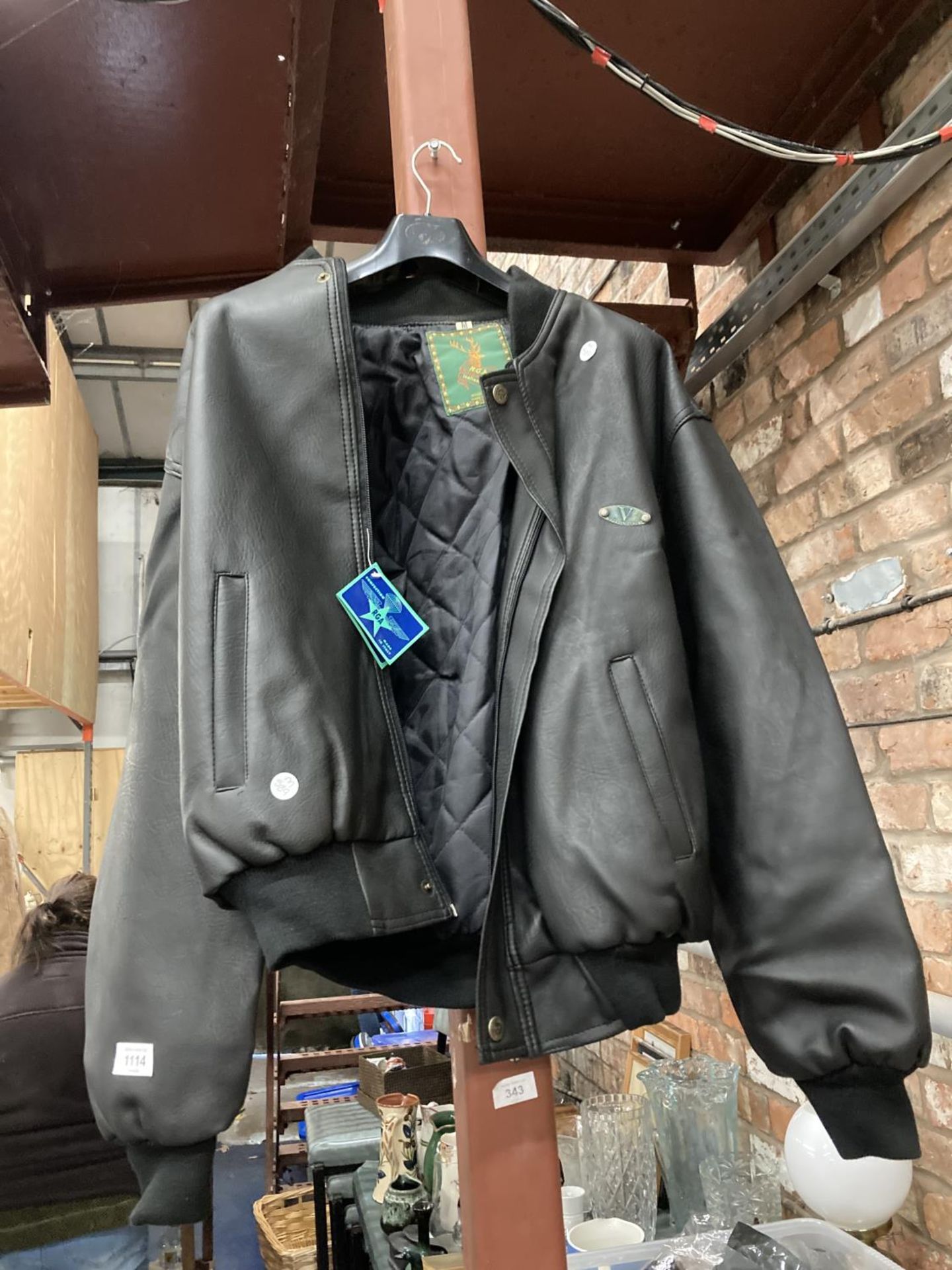 AN AS NEW ITALIAN BLACK LEATHER LOOK JACKET IN MEDIUM