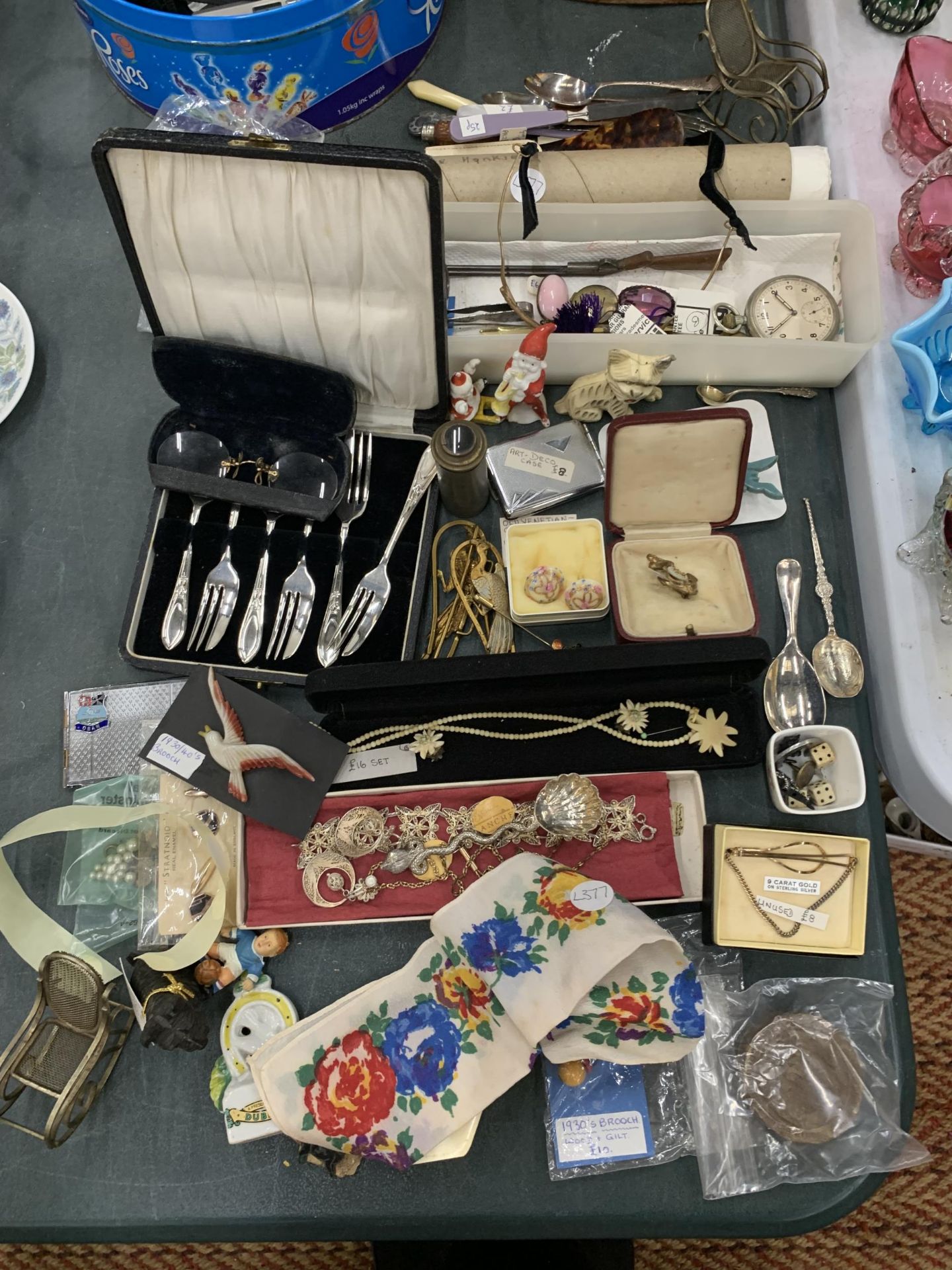 A LARGE MIXED LOT TO INCLUDE COSTUME JEWELLERY, FIGURES, FLATWARE, AN ART DECO CARD CASE, ETC