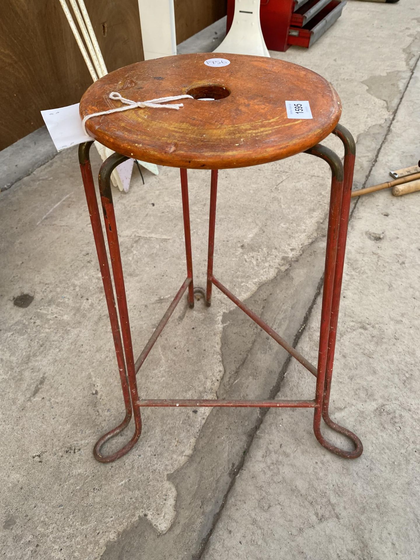 A WOODEN AND METAL INDUSTIAL STYLE STOOL