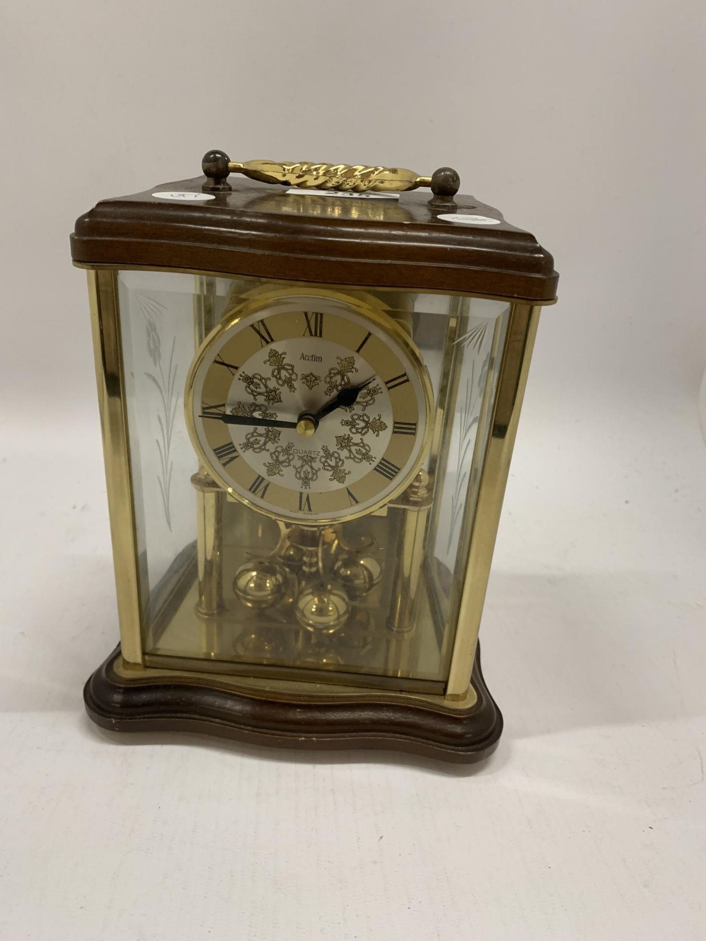 A WOOD AND GLASS CASED ANNIVERSARY CLOCK MADE BY ACCTIM