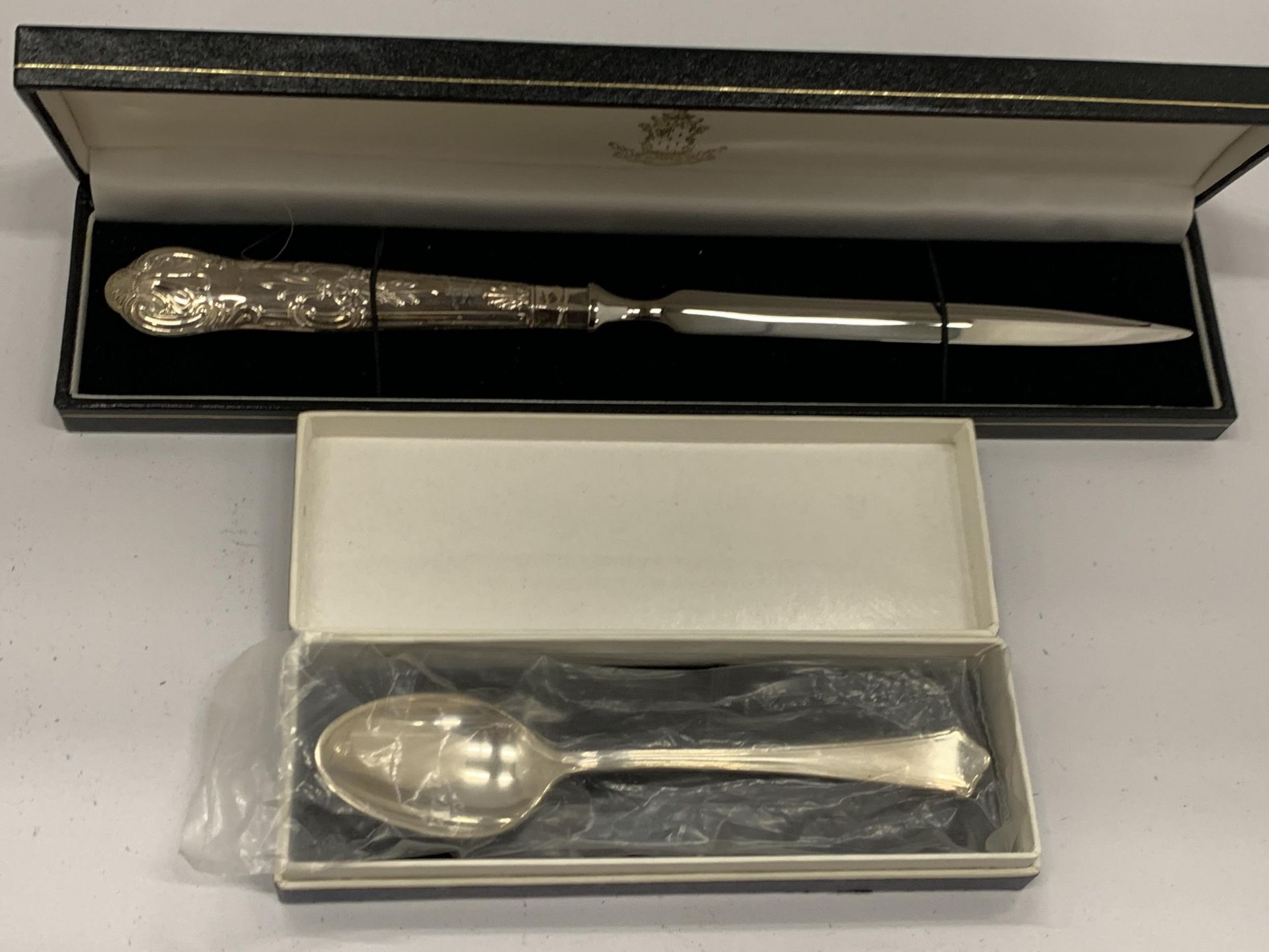 TWO BOXED ITEMS TO INCLUDE A SILVER HANDLED LETTER OPENER & A SILVER TEASPOON