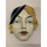 AN ART DECO STYLE FACE MASK, STAMPED 197, MADE IN ENGLAND