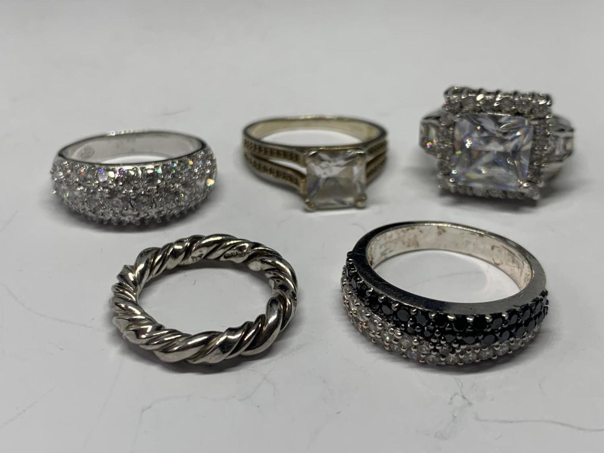 FIVE VARIOUS SILVER RINGS