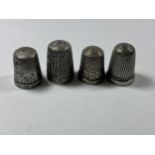 A GROUP OF THREE HALLMARKED SILVER THIMBLES AND FURTHER PLATED EXAMPLE