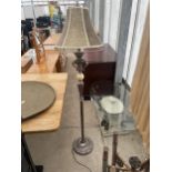 A METAL WARE STANDARD LAMP COMPLETE WITH SHADE