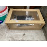 A WOODEN BOX INCUBATOR