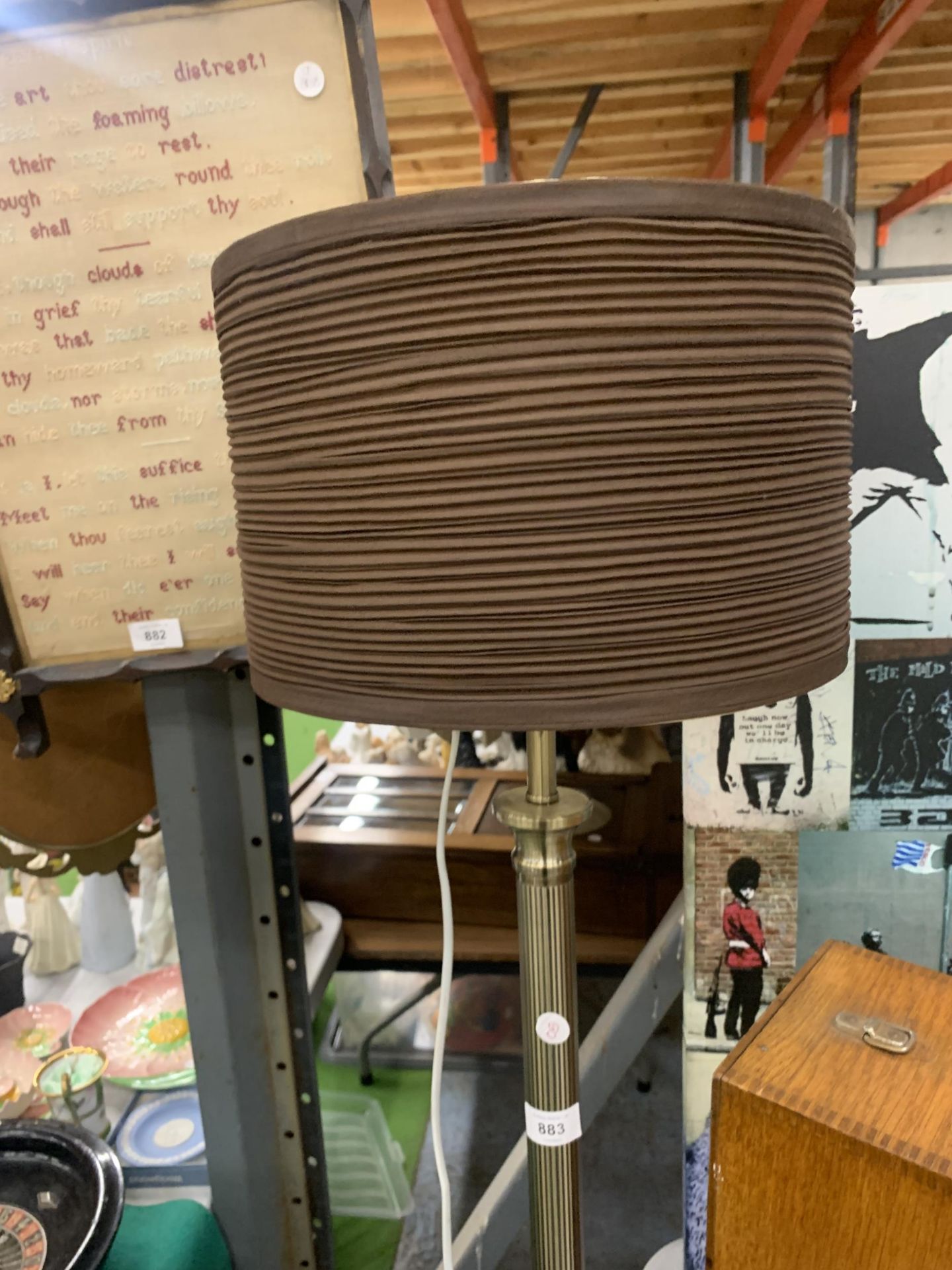 A RETRO STYLE METAL STANDARD LAMP ON A STEPPED PEDESTAL