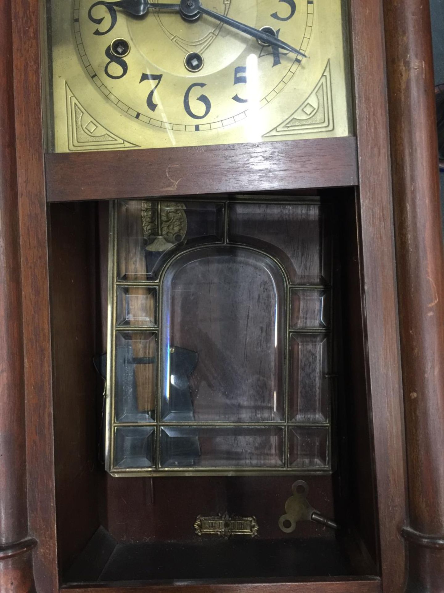 A MAHOGANY FRAMED WALL CLOCK WITH BEVELLED GLASS DOOR, PENDULUM AND KEY IN NEED OF SOME - Image 8 of 8