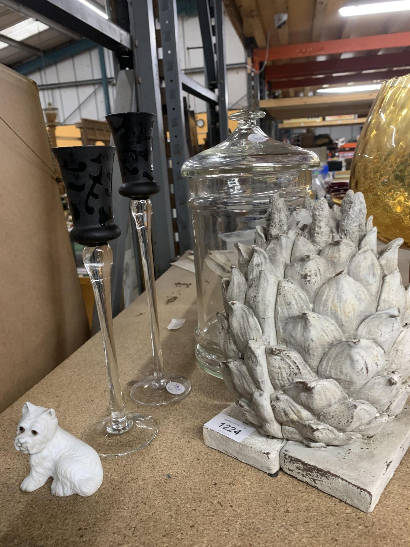 A PAIR OF PINEAPPLE BOOKENDS, LARGE GLASS STORAGE JAR AND CANDLESTICKS