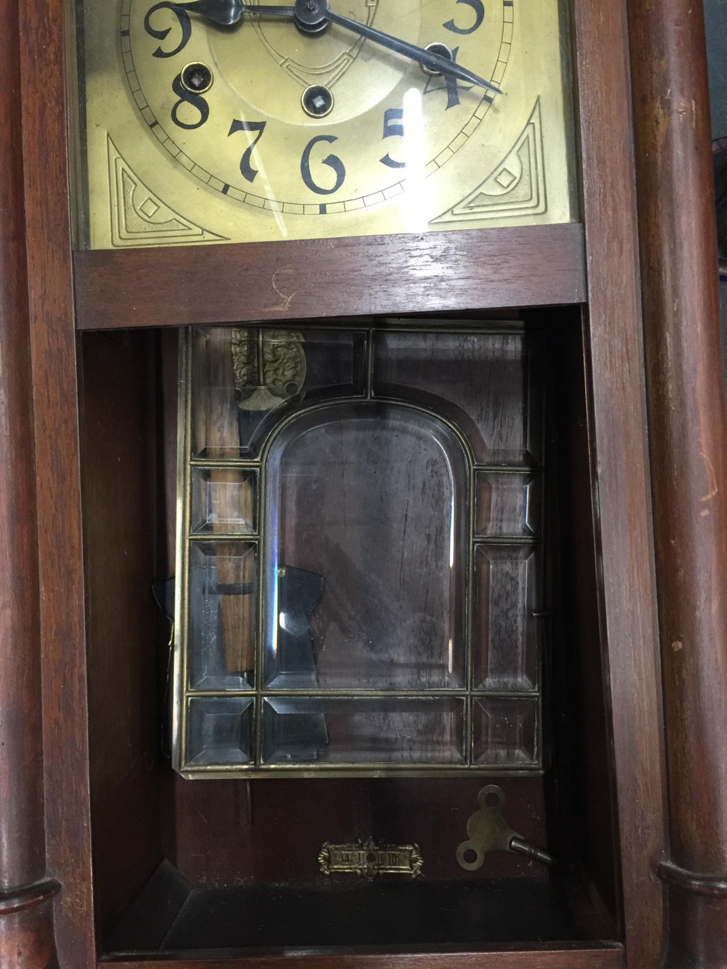 A MAHOGANY FRAMED WALL CLOCK WITH BEVELLED GLASS DOOR, PENDULUM AND KEY IN NEED OF SOME - Image 7 of 8