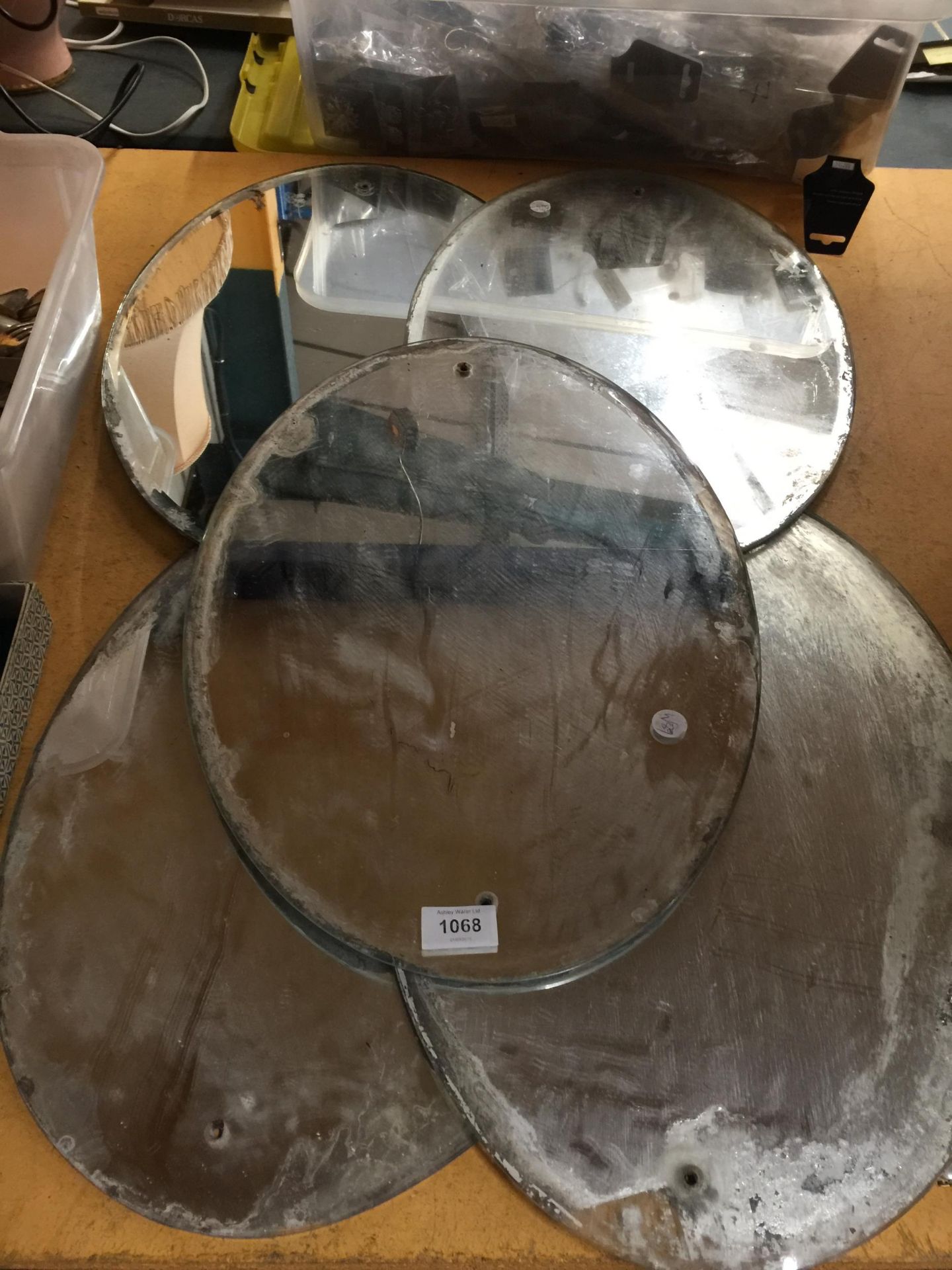 FIVE UNFRAMED OVAL MIRRORS