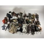 A LARGE COLLECTION OF LORD OF THE RINGS FIGURES AND WEAPONS AND ACCESSORIES ETC