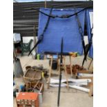 AN ASSORTMENT OF ARCHERY EQUIPMENT TO INCLUDE A TARGET BOARD, THREE BOWS, A NUMBER OF ARROWS AND