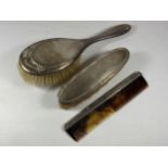 A THREE PIECE HALLMARKED SILVER DRESSING SET COMPRISING BRUSH, COMB & CLOTHES BRUSH