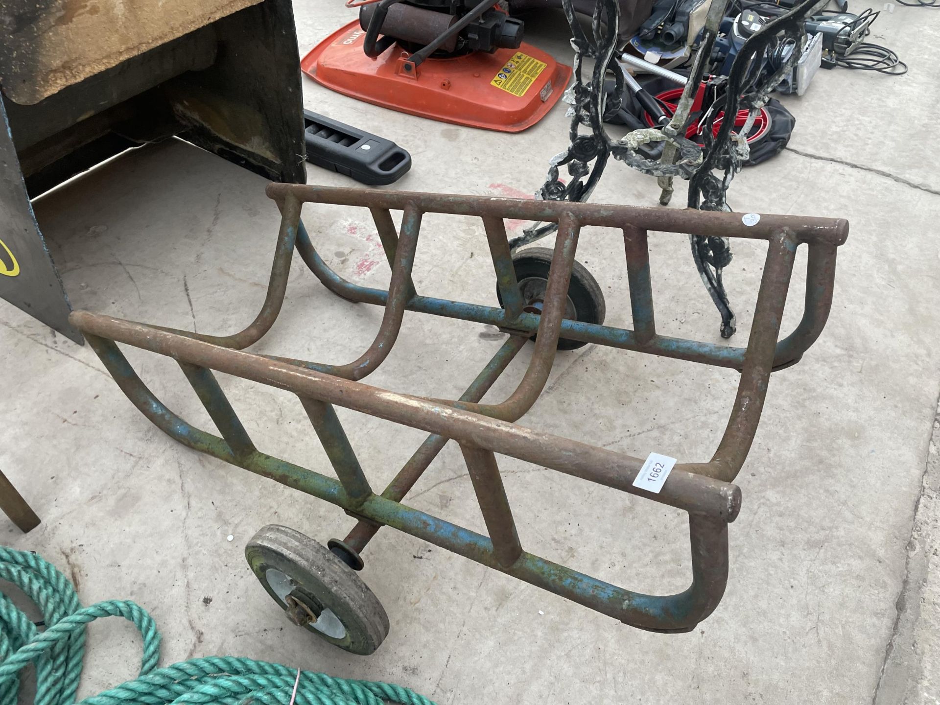 A METAL TWO WHEELED BARRELL TROLLEY