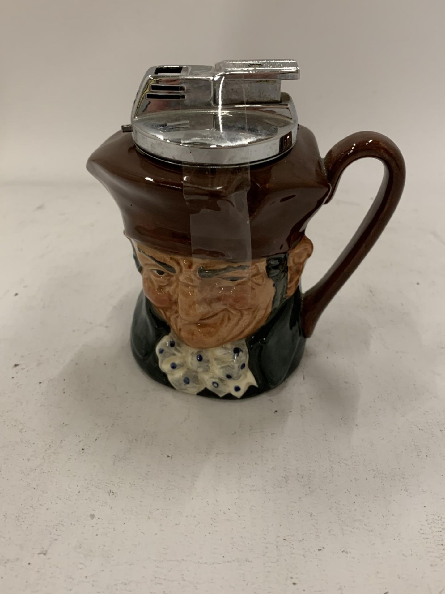 A ROYAL DOULTON OLD CHARLEY TABLE LIGHTER