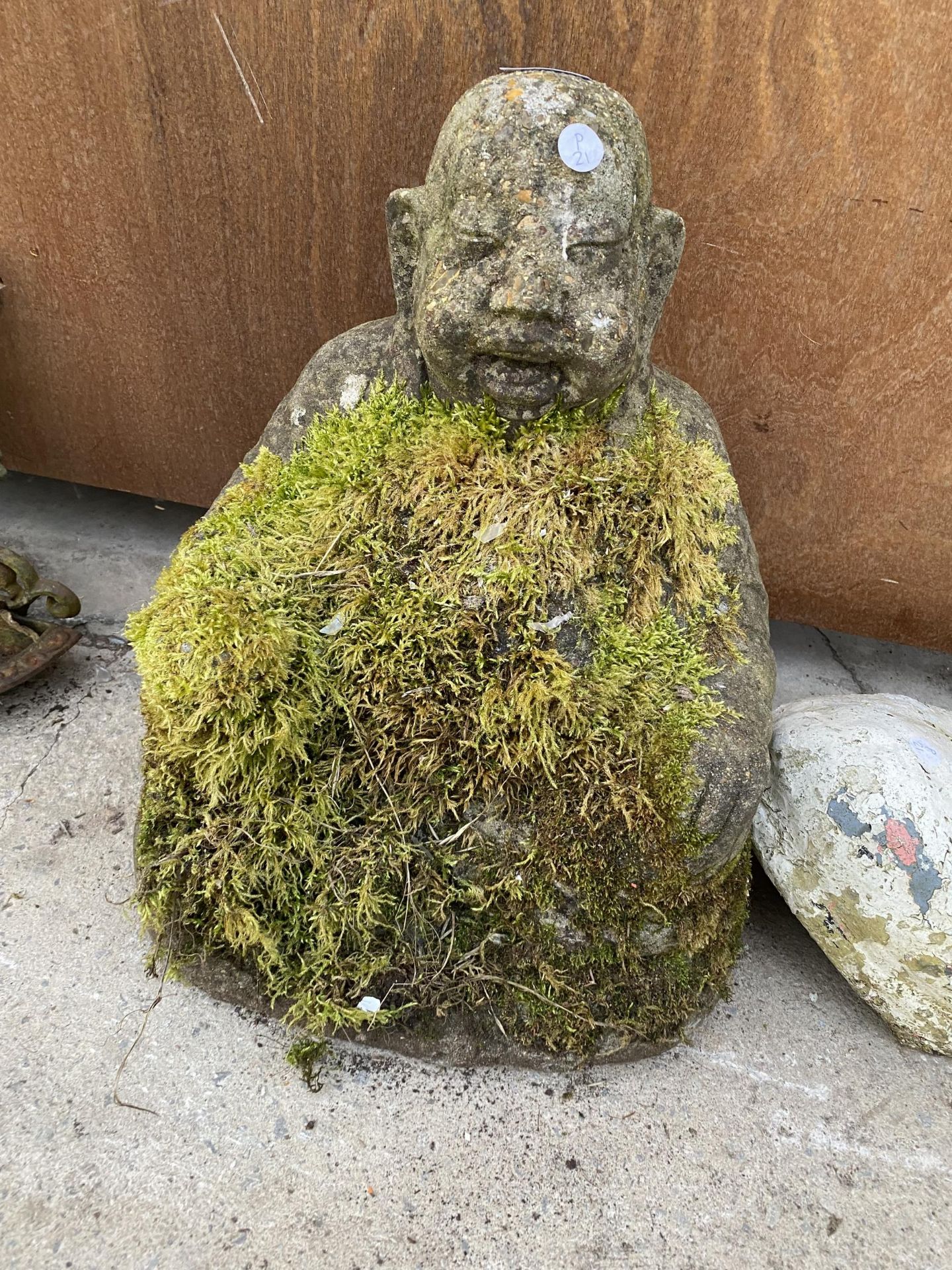 A RECONSTITUTED STONE BUDDHA FIGURE