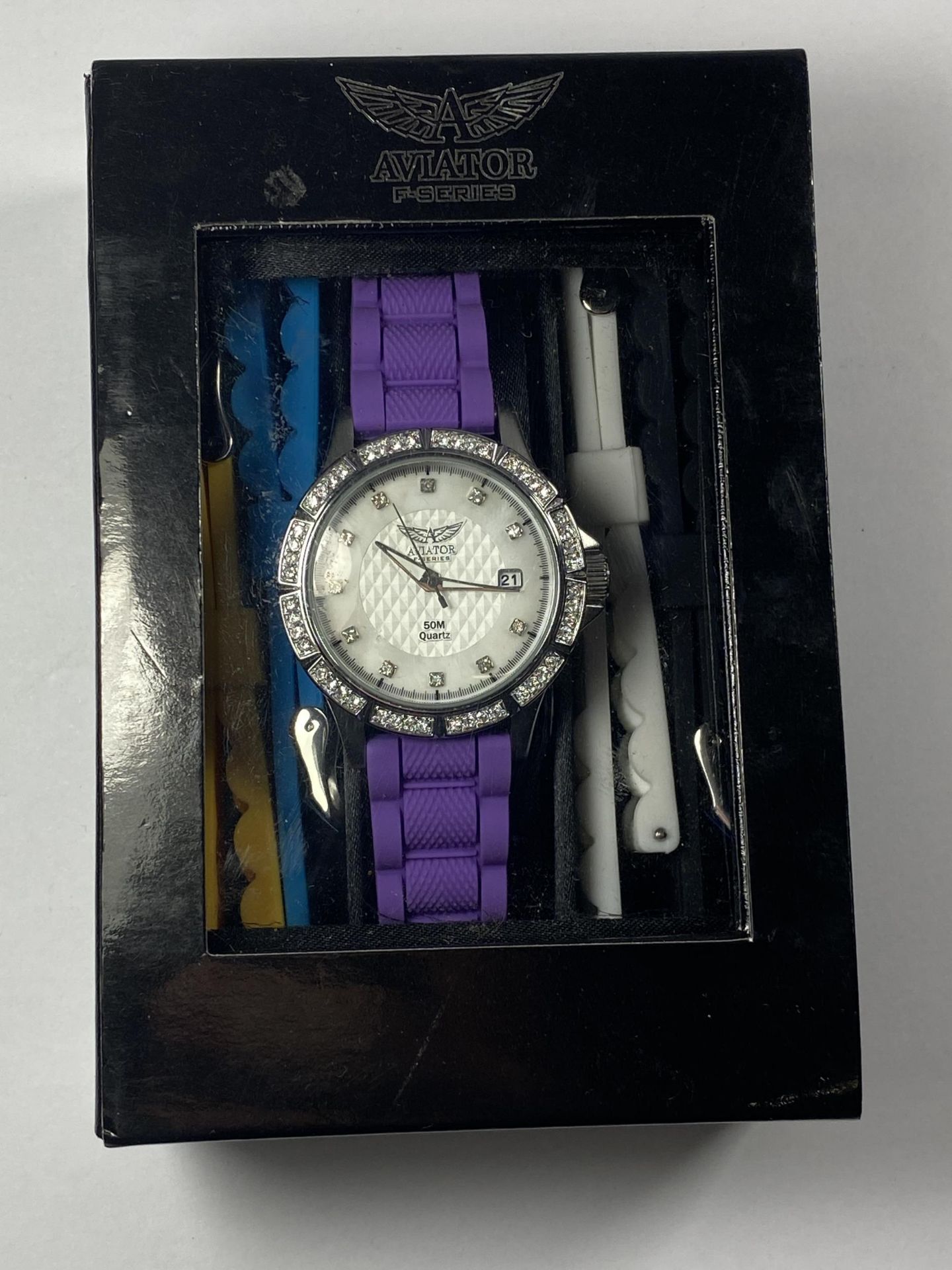 AN AVIATOR WRIST WATCH WITH INTER CHANGABLE STRAPS IN A PRESENTATION BOX