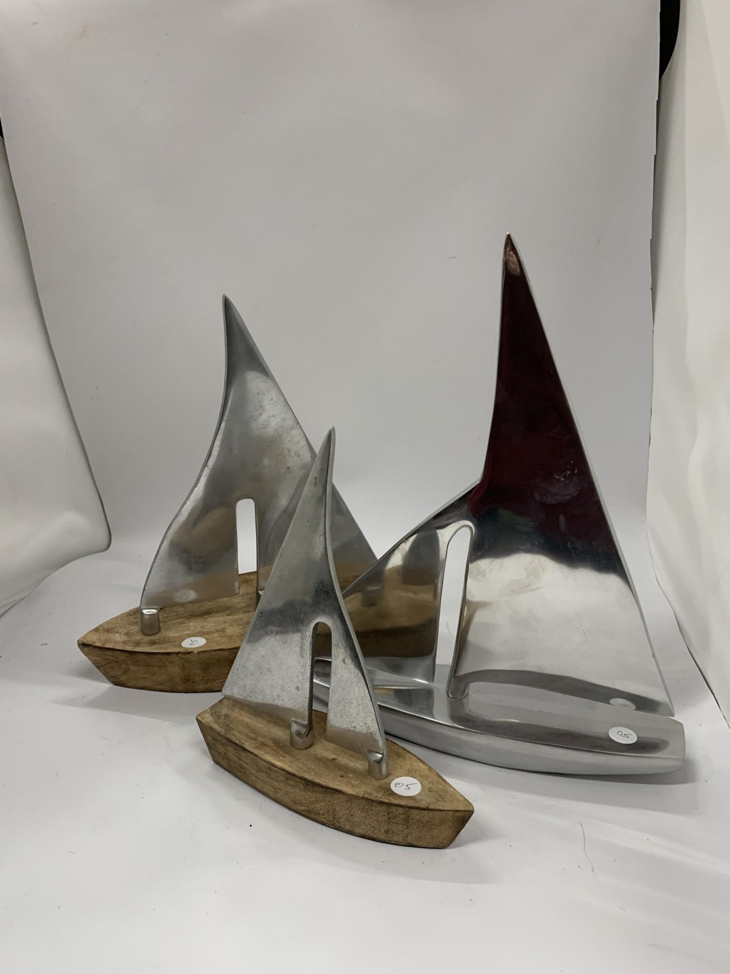 A COLLECTION OF THREE DANISH CHROME SHIP MODELS