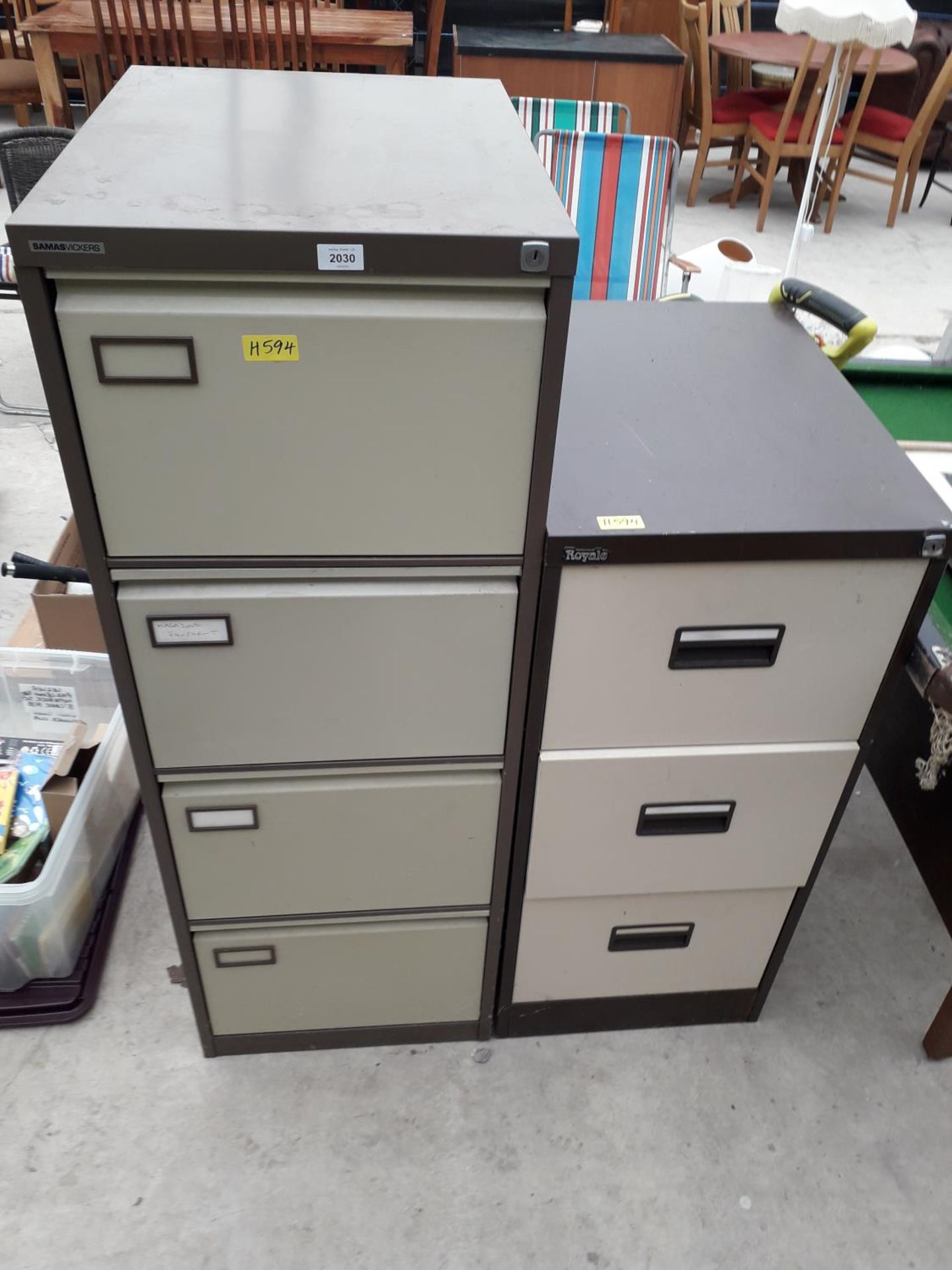 A METAL FOUR DRAWER FILING CABINET AND A FURTHER METAL THREE DRAWER FILING CABINET