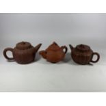 A GROUP OF THREE CHINESE YIXING CLAY TEAPOTS, LARGEST 10.5CM