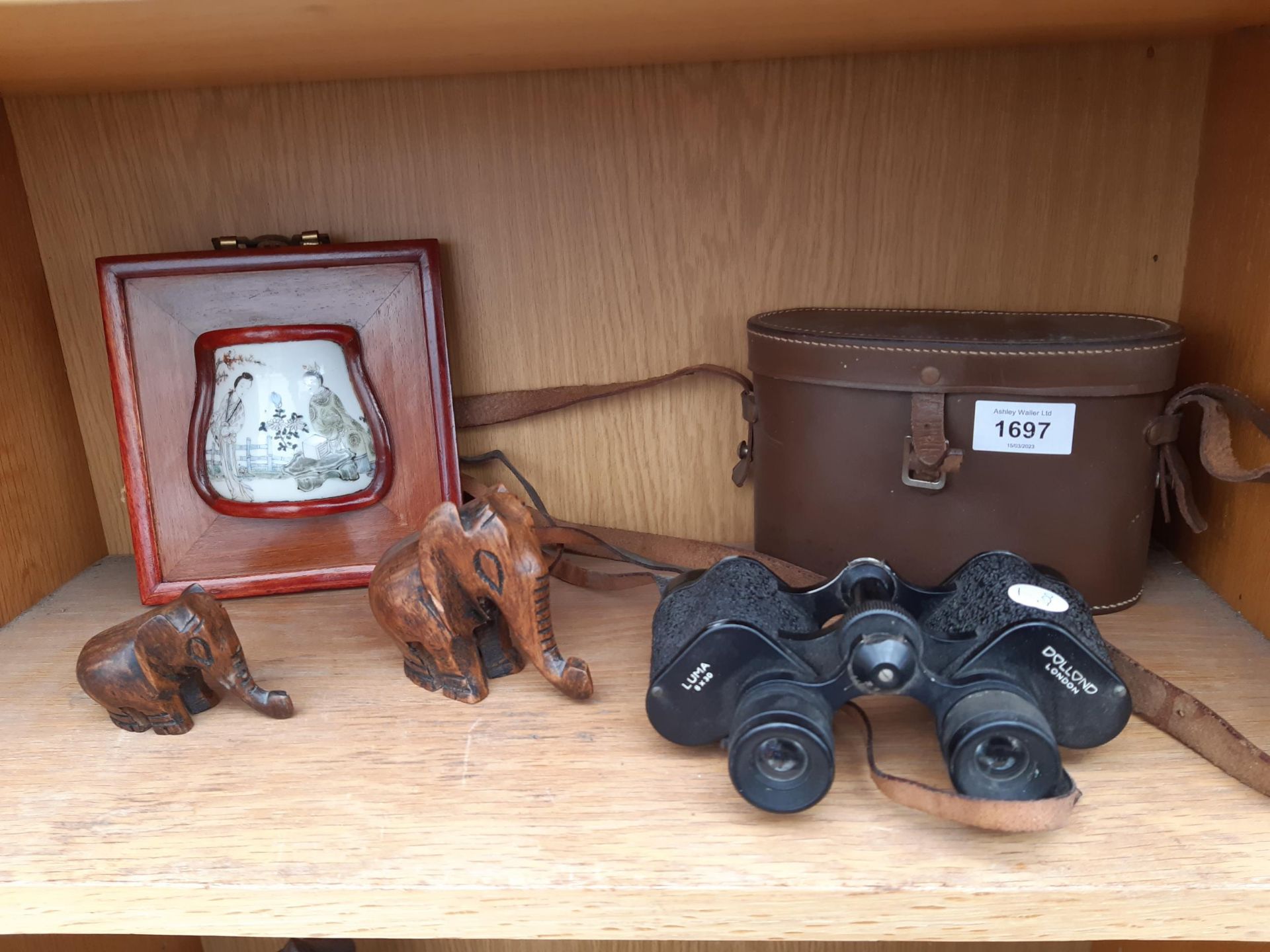 A PAIR OF VINTAGE DOLLOND BINOCULARS, TWO TREEN ELEPHANTS AND AN ORIENTAL WALL PLAQUE ETC