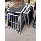 A HARD CASED TWO WHEELED TROLLEY AND A DOG CAR CRATE