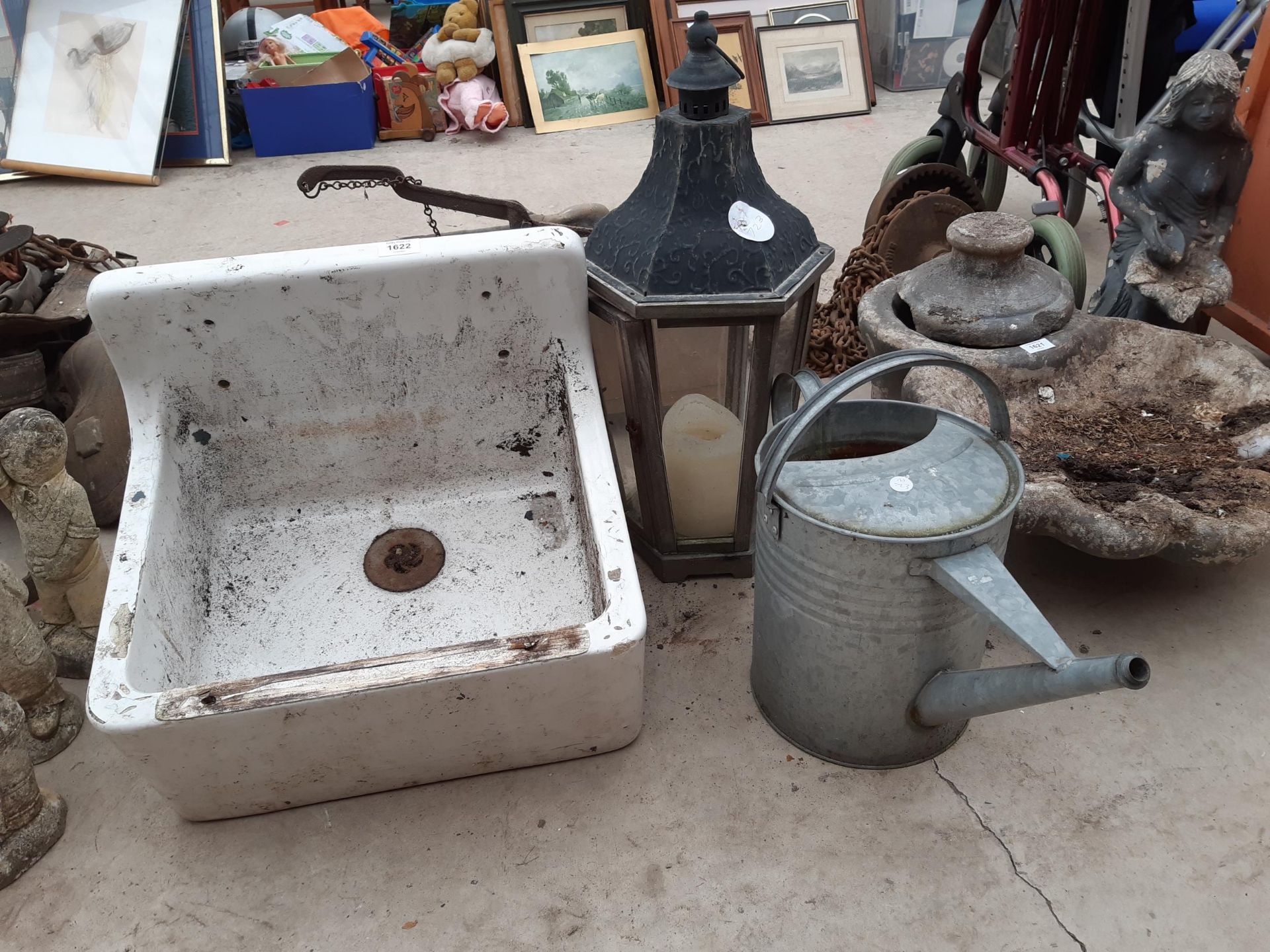 A WHITE BELFAST SINK, A GALVANISED WATERING CAN AND A CANDLE LANTERN