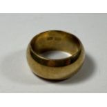 A YELLOW METAL WEDDING BAND, (STAMPED 18K BUT TESTED AS NOT GOLD)