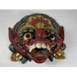 A VINTAGE CARVED WOODEN TRIBAL DRAGON MASK