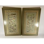 A PAIR OF GILT FRAMED CHINESE SILK PICTURES OF FIGURES ON A GREEN SILK GROUND, 71 X 43CM