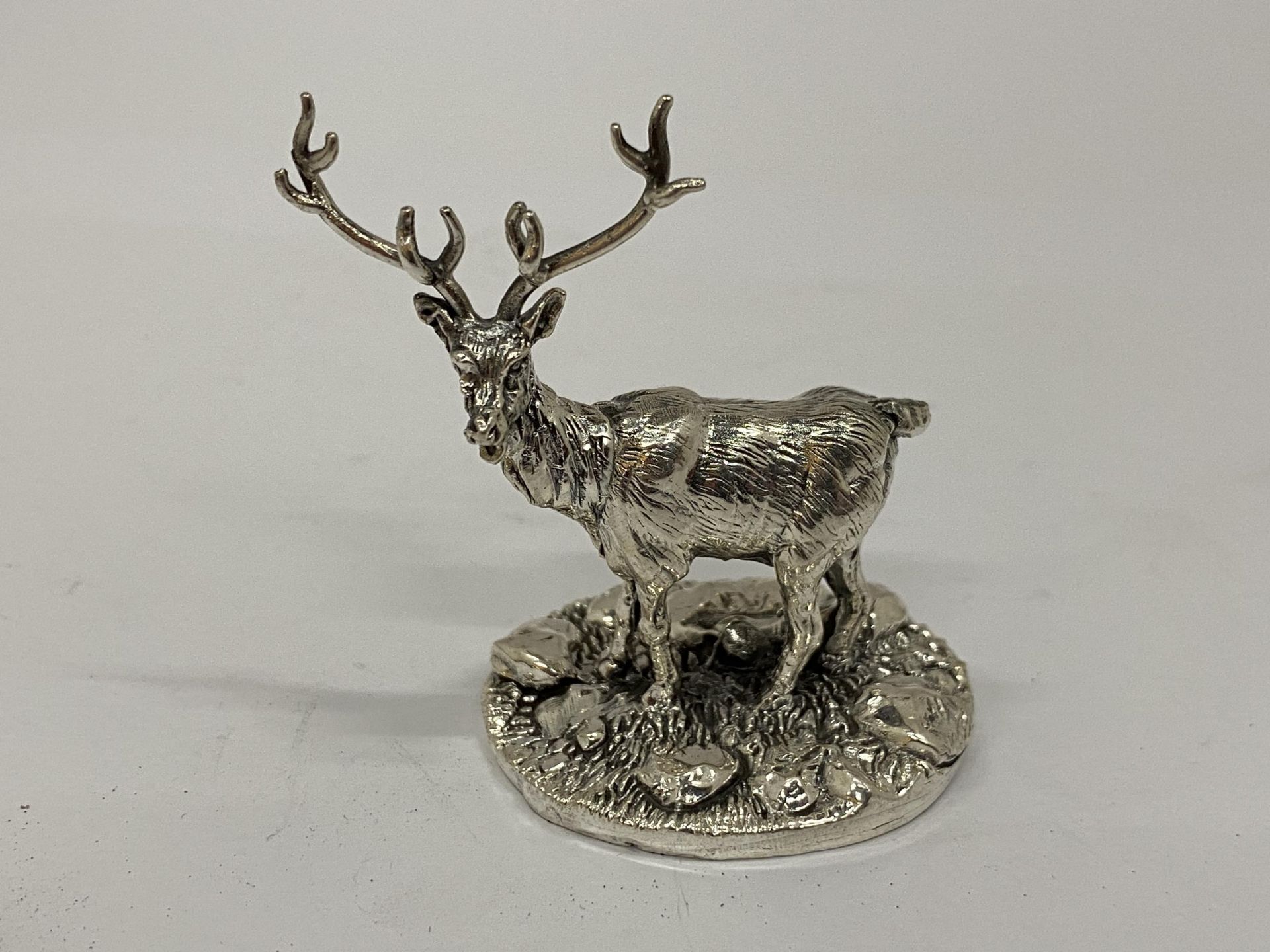 A HALLMARKED SILVER FILLED CAMELOT SILVERWARE LTD STAG FIGURE