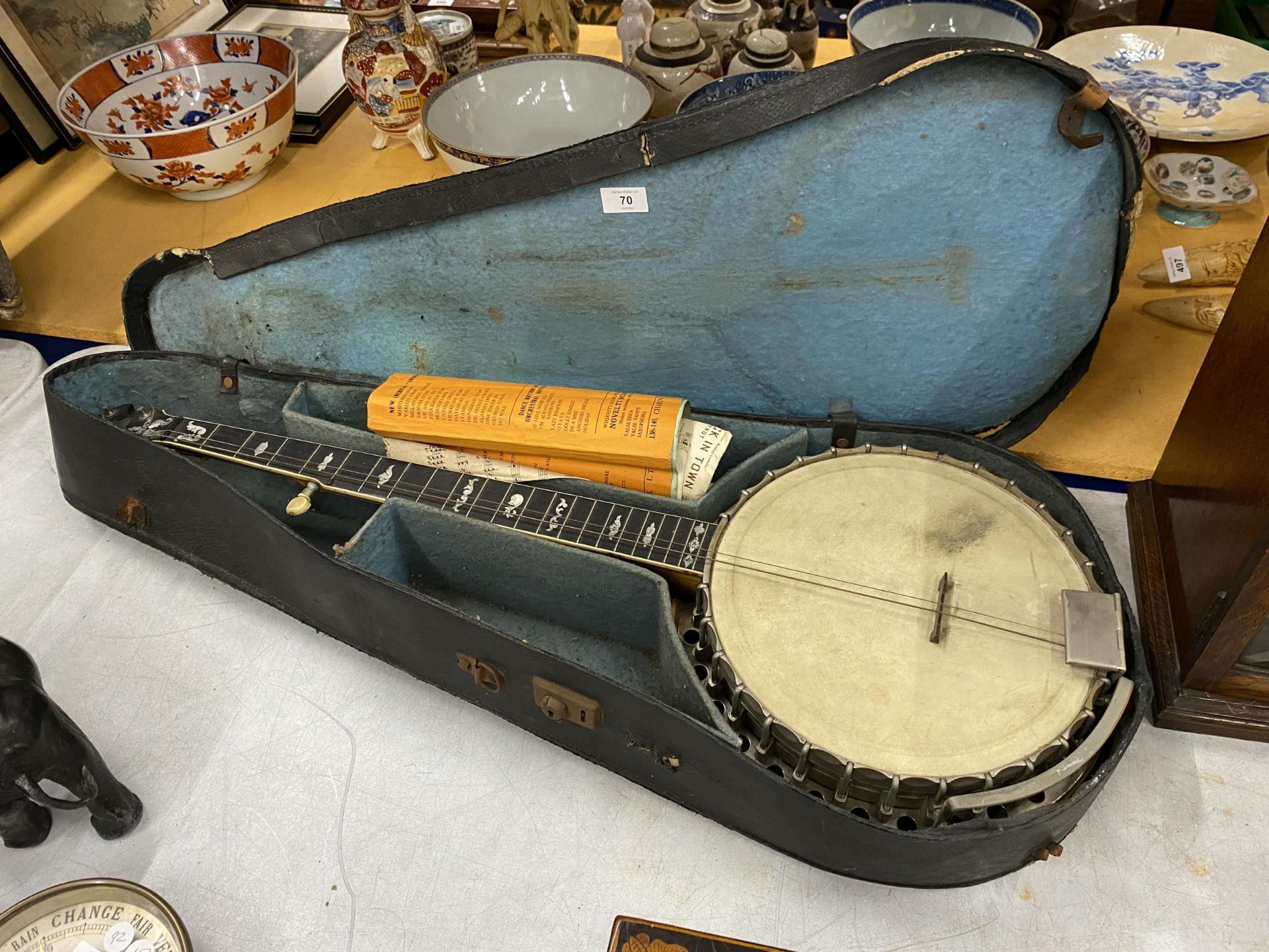 A VINTAGE CASED 'PARAGON' BANJO WITH MOTHER OF PEARL FRETBOARD