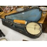 A VINTAGE CASED 'PARAGON' BANJO WITH MOTHER OF PEARL FRETBOARD