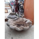 A RECONSTITUTED BIRD BATH TOP AND A FIGURE OF A FEMALE