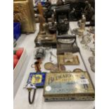 A LARGE COLLECTION OF VINTAGE ITEMS TO INCLUDE SCALES AND WEIGHTS, TINS, BRASS BELLS, DOORSTOP ETC