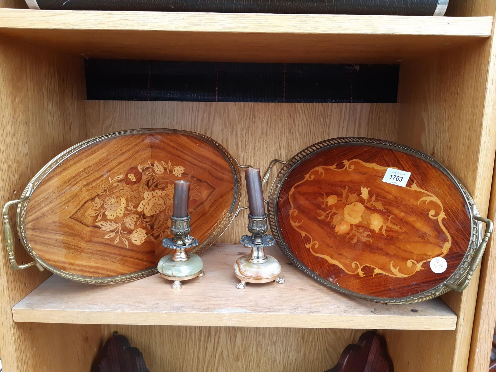 TWO VINTAGE WOODEN TRAYS WITH BRASS GALLERY AND TWO ONYX CANDLE STICKS