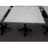 A PUB TABLE WITH WOODEN TOP AND CAST IRON TABLE BASE (79CM x 79CM)