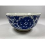 A QING 19TH CENTURY CHINESE BLUE AND WHITE PORCELAIN BOWL WITH LOTUS DESIGN, FOUR CHARACTER MARK