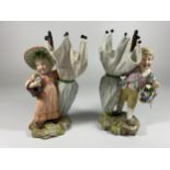 A PAIR OF 19TH CENTURY DRESDEN STYLE CONTINENTAL HARD PASTE PORCELAIN FIGURES WITH CROSSED SWORD